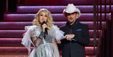 brad-paisley-and-carrie-underwood-speak-onstage-during-the-news-photo-1061536302-1542247014.jpg