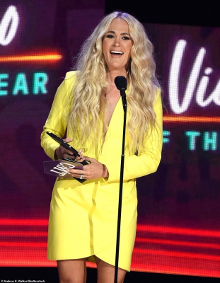 44042993-9670571-Carrie_Underwood_capped_off_the_2021_CMT_Music_Awards_on_Wednesd-m-118_1623292729516.jpg