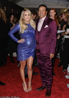 5148224-6288959-Famous_friends_She_posed_with_legendary_singer_Smokey_Robinson-m-234_1539845341365.jpg