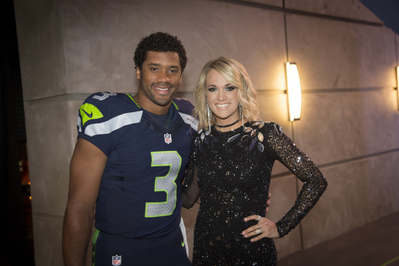 With Russel Wilson
