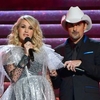 brad-paisley-and-carrie-underwood-speak-onstage-during-the-news-photo-1061536302-1542247014.jpg